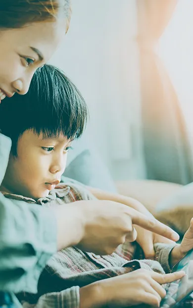 Parent and child looking at a computer